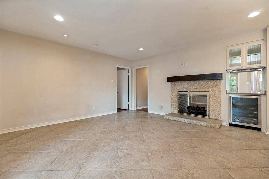 See thru fireplace. Beverage cooler with pass thru to living room.