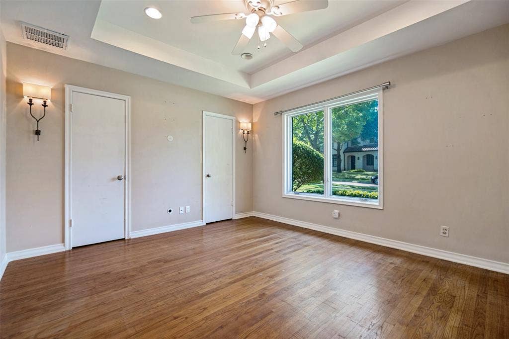 Primary bedroom with designer sconces.
