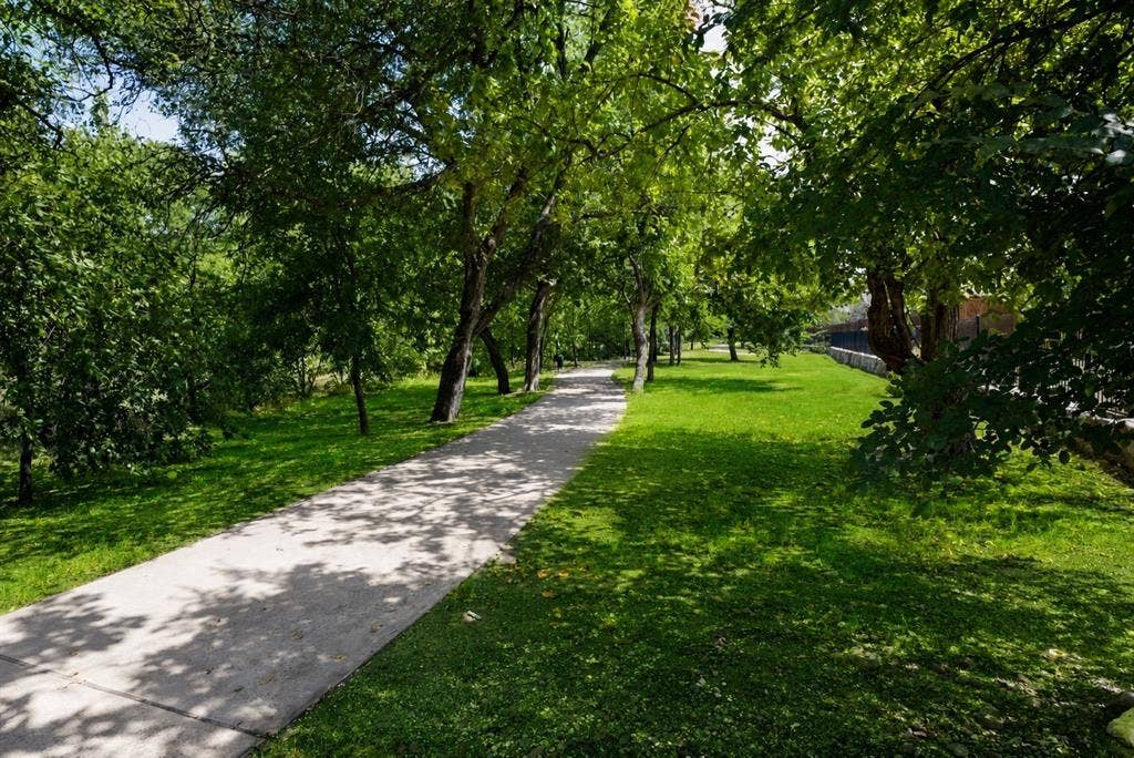 Nearby walking path with gorgeous greenbelt views and shaded wooded area. Nature trails.