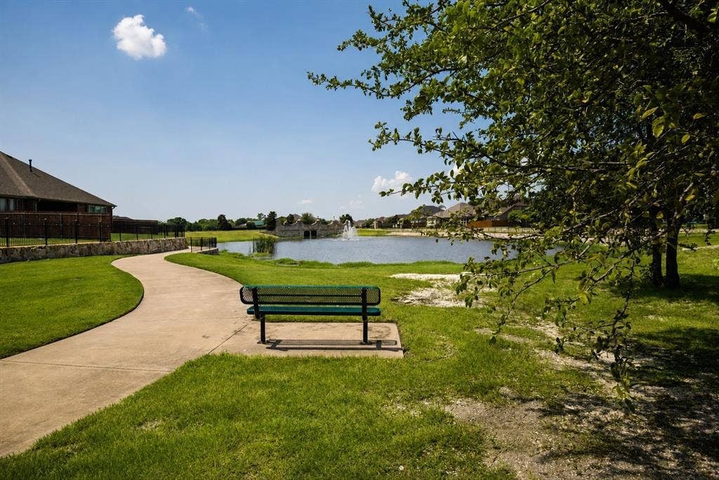 Nearby walking path with pretty greenbelt views, shaded wooded area & pond views. Nature trails.