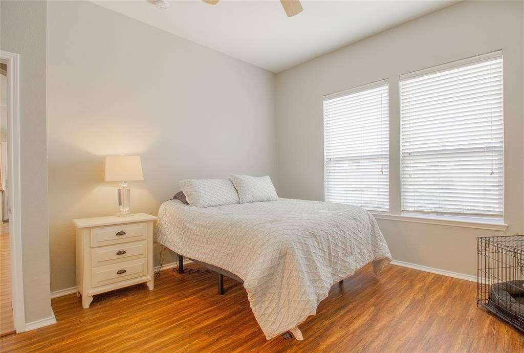 406 Hackberry Drive, Fate, TX 75087 Room featuring warm wood-finish flooring and light-toned walls