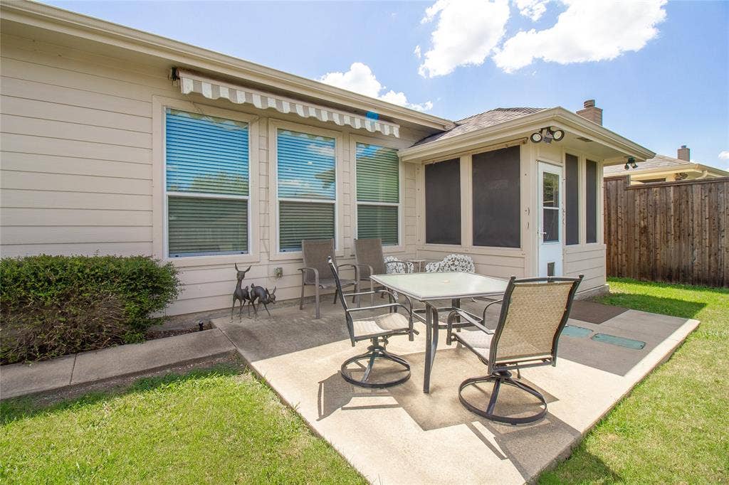 406 Hackberry Drive, Fate, TX 75087 Expansive concrete patio featuring a screened enclosure