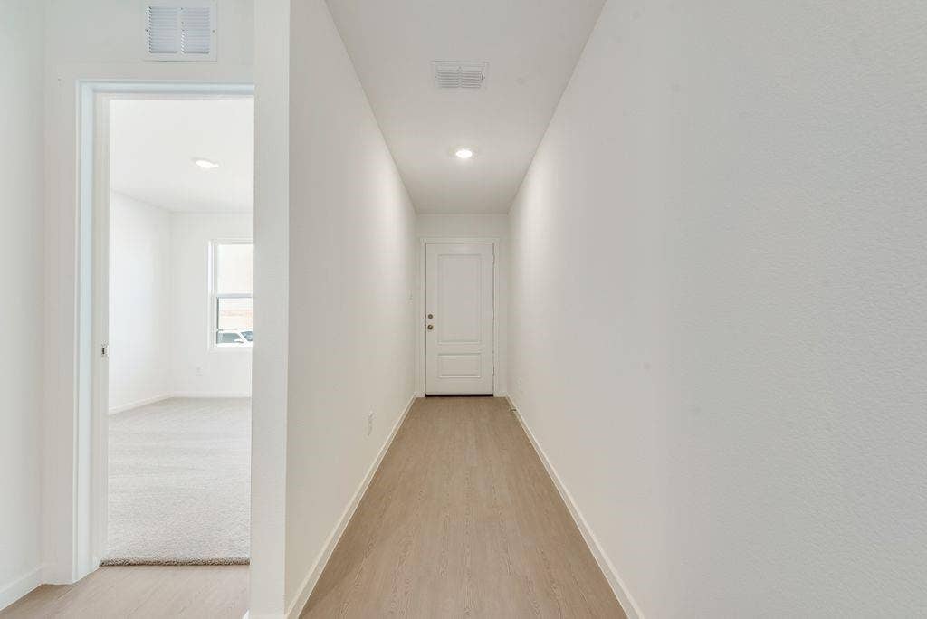 1271 Falcon Heights, Forney, TX 75126 Hallway featuring light wood finished floors and baseboards