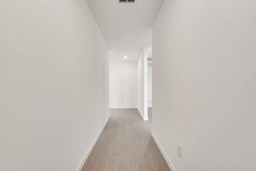 1271 Falcon Heights, Forney, TX 75126 Corridor with wood finished floors and recessed lighting