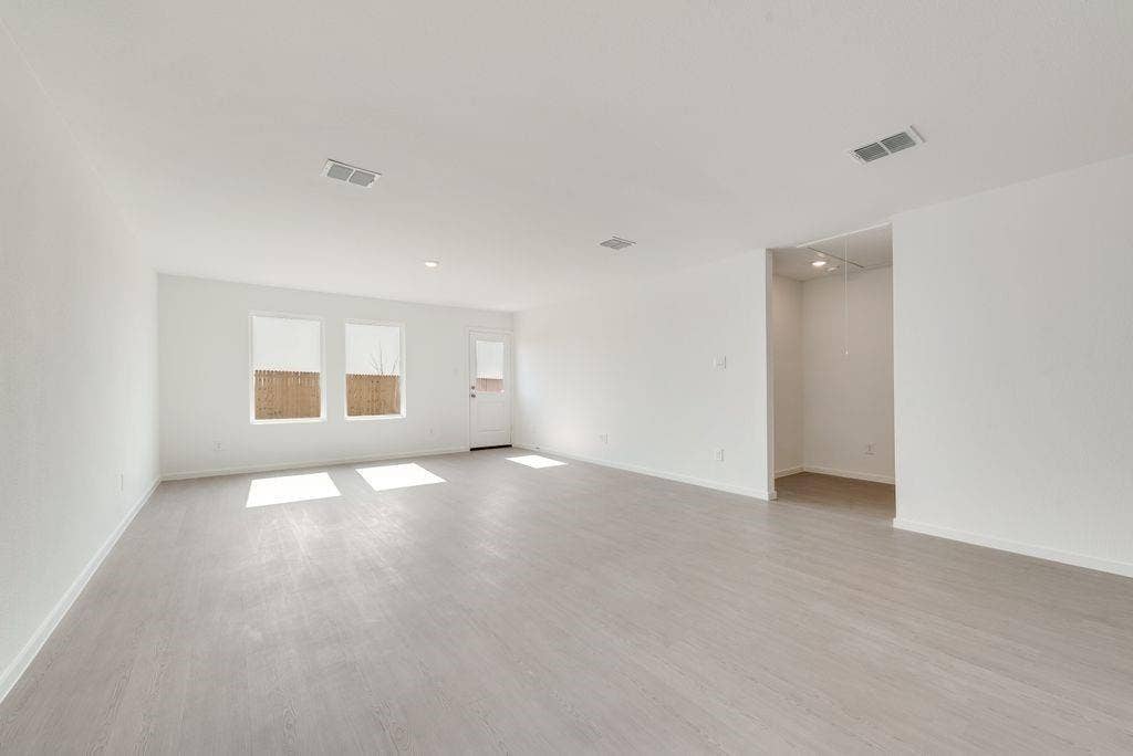 1271 Falcon Heights, Forney, TX 75126 Spare room featuring wood finished floors