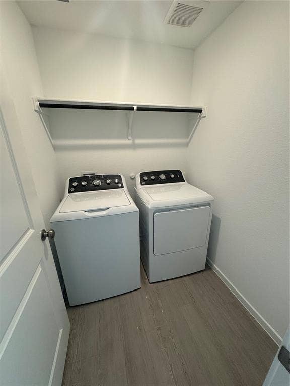 1271 Falcon Heights, Forney, TX 75126 Washroom featuring light wood-style floors and independent washer and dryer
