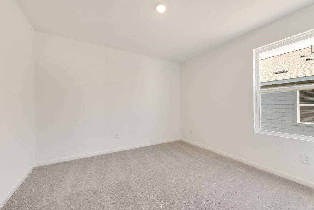 1271 Falcon Heights, Forney, TX 75126 Empty room featuring light carpet and recessed lighting