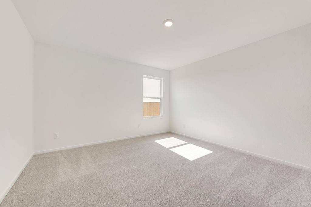 1271 Falcon Heights, Forney, TX 75126 Spare room featuring carpet and baseboards