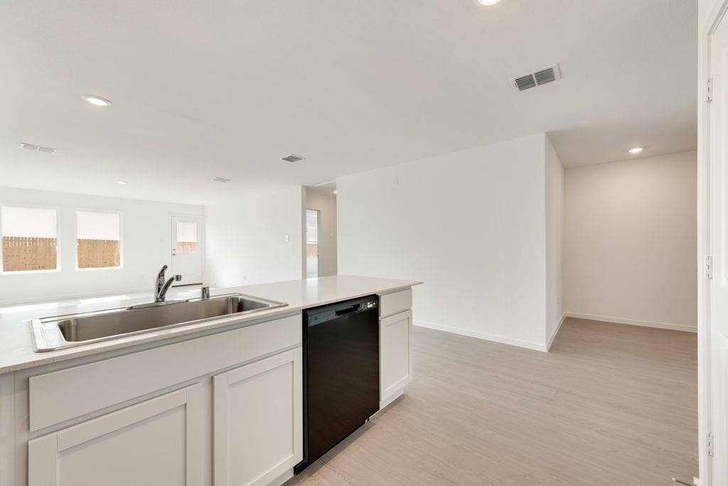 1271 Falcon Heights, Forney, TX 75126 Kitchen with dishwasher, recessed lighting, light wood-style floors, light countertops, and white cabinets