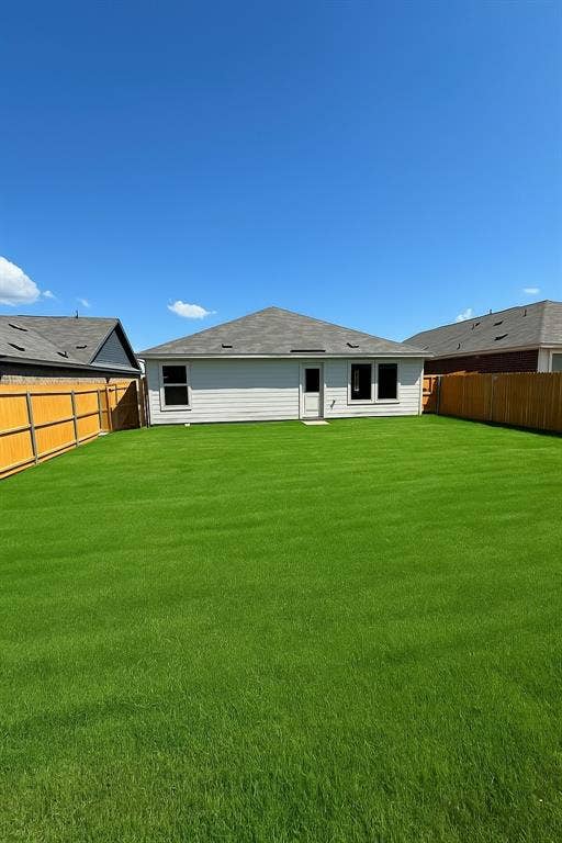 1271 Falcon Heights, Forney, TX 75126 Back of property with a fenced backyard