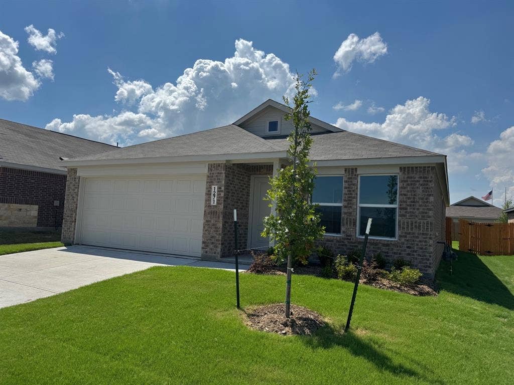 1271 Falcon Heights, Forney, TX 75126 View of front of home featuring concrete driveway, brick siding, and a garage