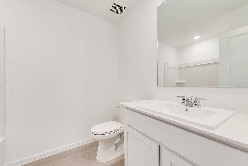 1271 Falcon Heights, Forney, TX 75126 Bathroom with vanity and wood finished floors