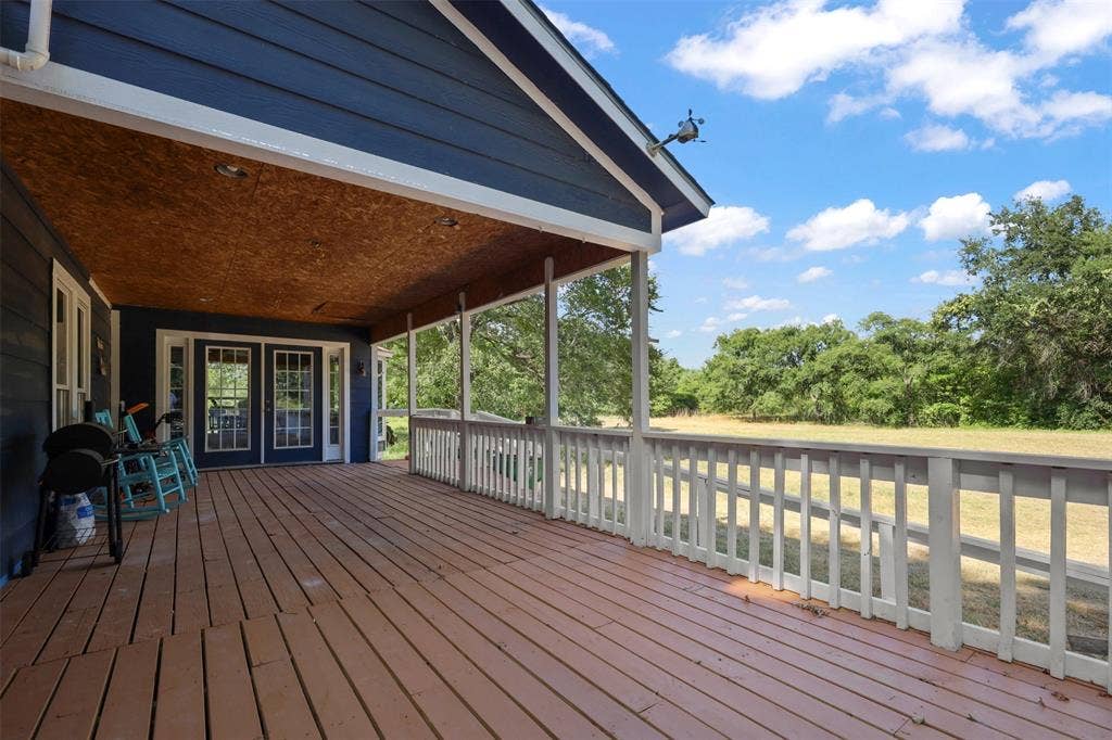 28300 County Road 2100, Kemp, TX 75143 Spacious covered deck featuring wood-finish flooring and a white railing system