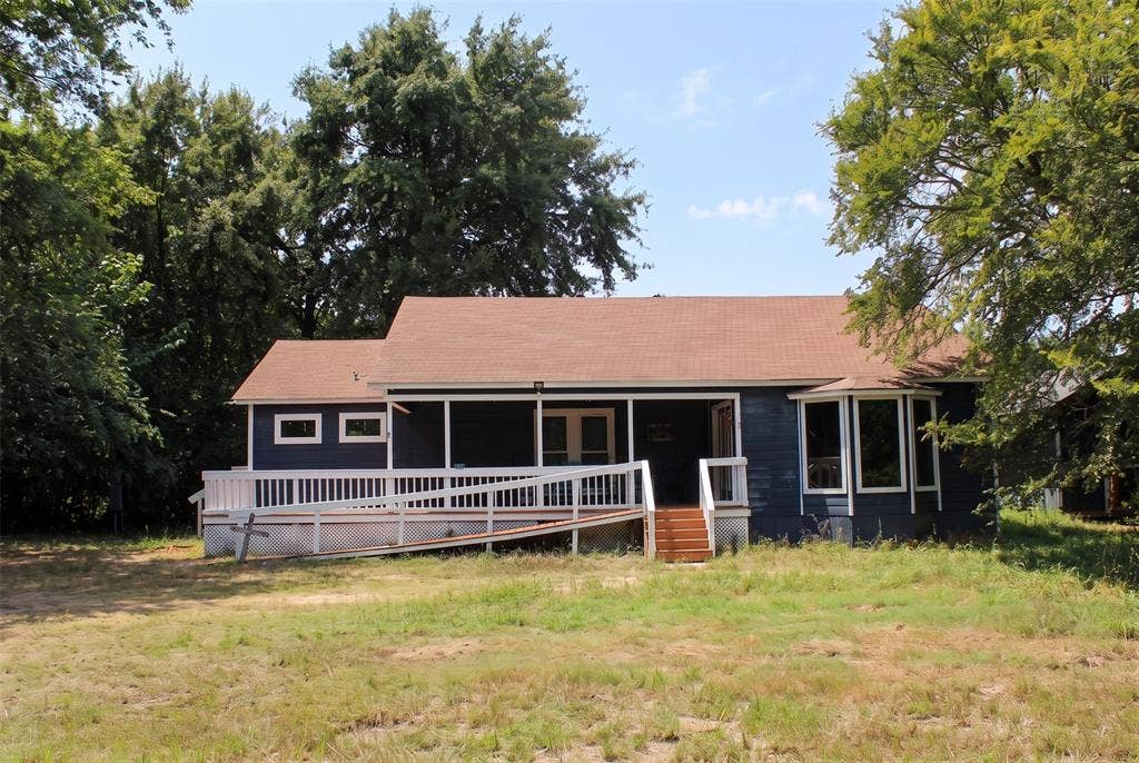 28300 County Road 2100, Kemp, TX 75143 Single-story residence featuring a blue exterior, a covered front porch, and a bay window