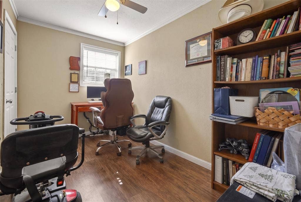 28300 County Road 2100, Kemp, TX 75143 Room featuring wood-finish flooring, a ceiling fan with light fixture, and a window with blinds
