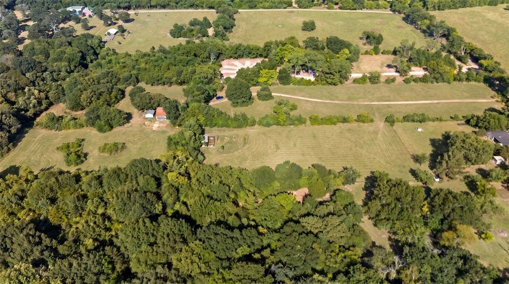 28300 County Road 2100, Kemp, TX 75143 Expansive property featuring a mix of mature trees and cleared land