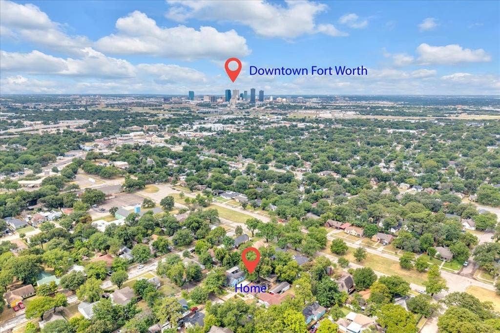 1113 Hudgins Avenue, Fort Worth, TX 76111 Aerial perspective showcasing a residential area with extensive tree coverage