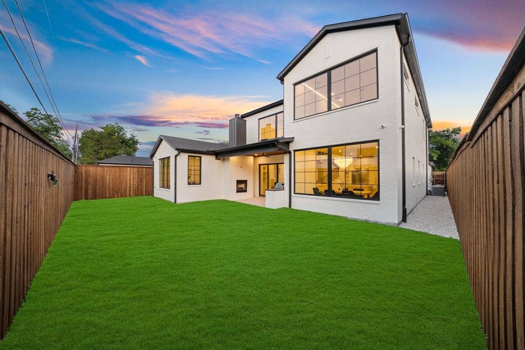 3723 Manana Drive, Dallas, TX 75220 Modern residence featuring a stucco exterior, black-framed windows, and a black roofline