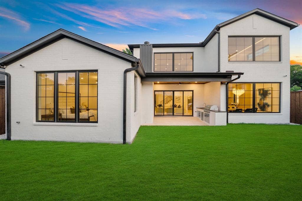 3723 Manana Drive, Dallas, TX 75220 Modern white brick exterior with black trim and large grid windows