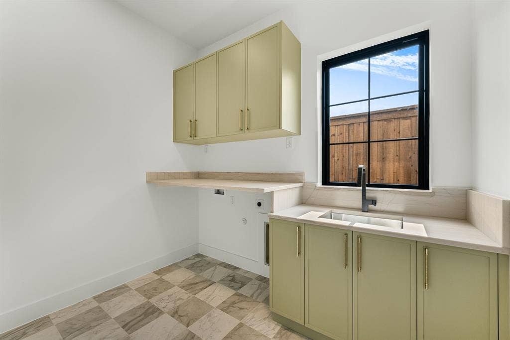 3723 Manana Drive, Dallas, TX 75220 Utility room featuring ample cabinetry and a divided sink