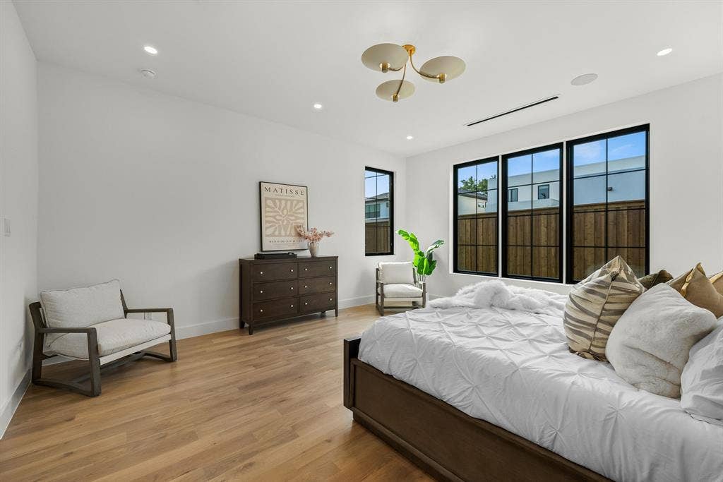 3723 Manana Drive, Dallas, TX 75220 Hardwood-finish flooring complements white walls and recessed lighting