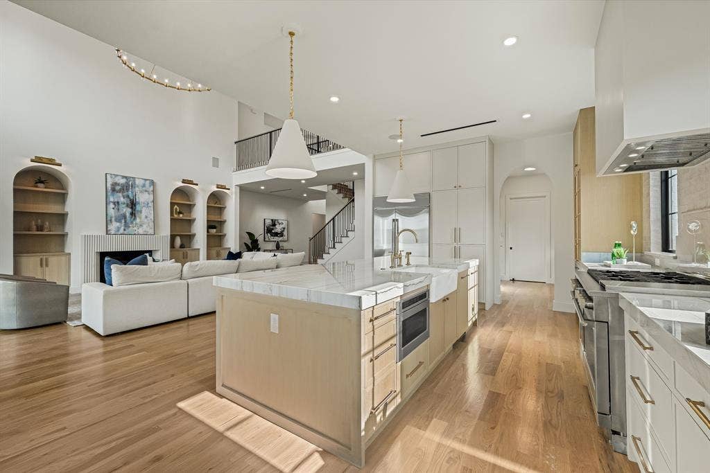 3723 Manana Drive, Dallas, TX 75220 Open-concept main living area with wood-finish flooring