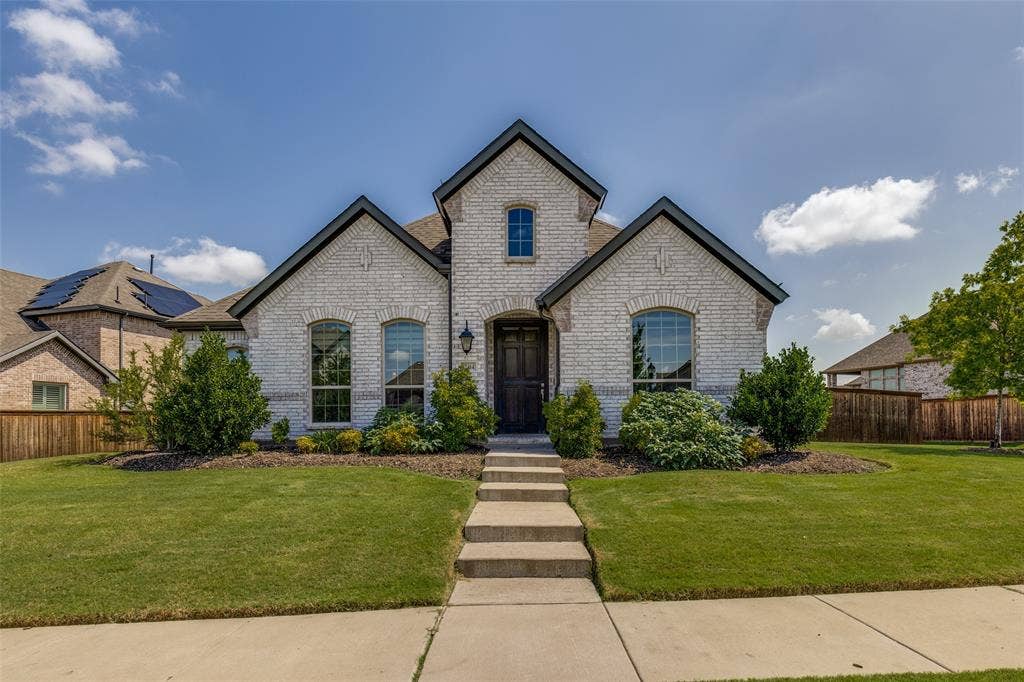 12464 Lost Valley Drive, Frisco, TX 75035 Light brick exterior with dark trim accents