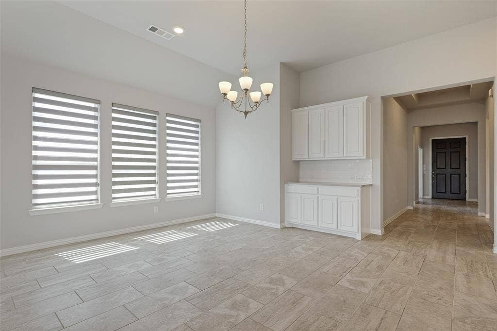 12464 Lost Valley Drive, Frisco, TX 75035 Bright dining area with soaring ceilings and built-in buffet