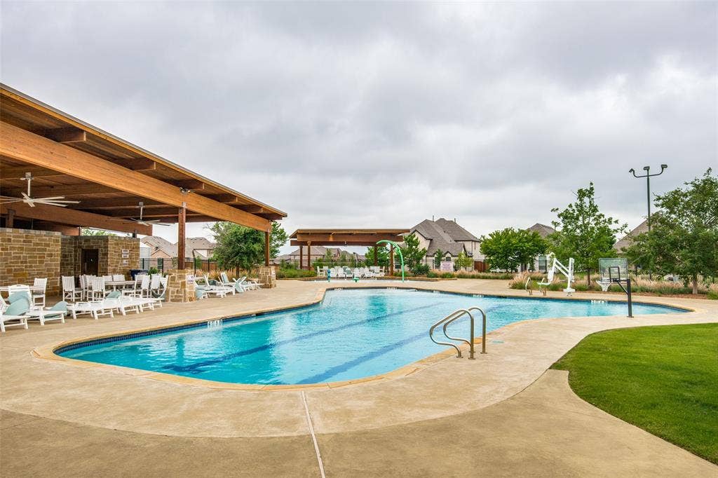 12464 Lost Valley Drive, Frisco, TX 75035 Expansive outdoor swimming pool with integrated lap lanes and concrete surround