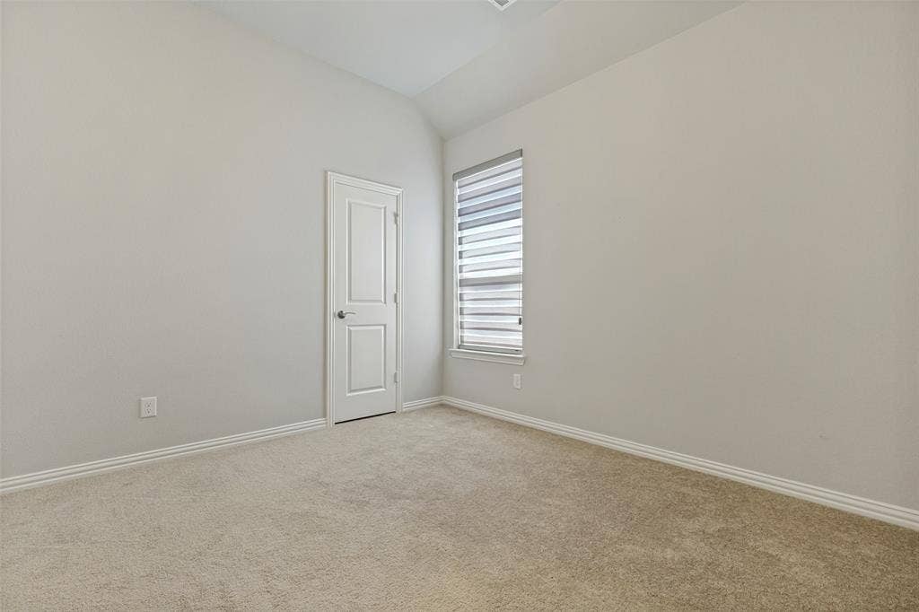 12464 Lost Valley Drive, Frisco, TX 75035 Bright secondary bedroom with vaulted ceilings,adjacent to a full bathroom