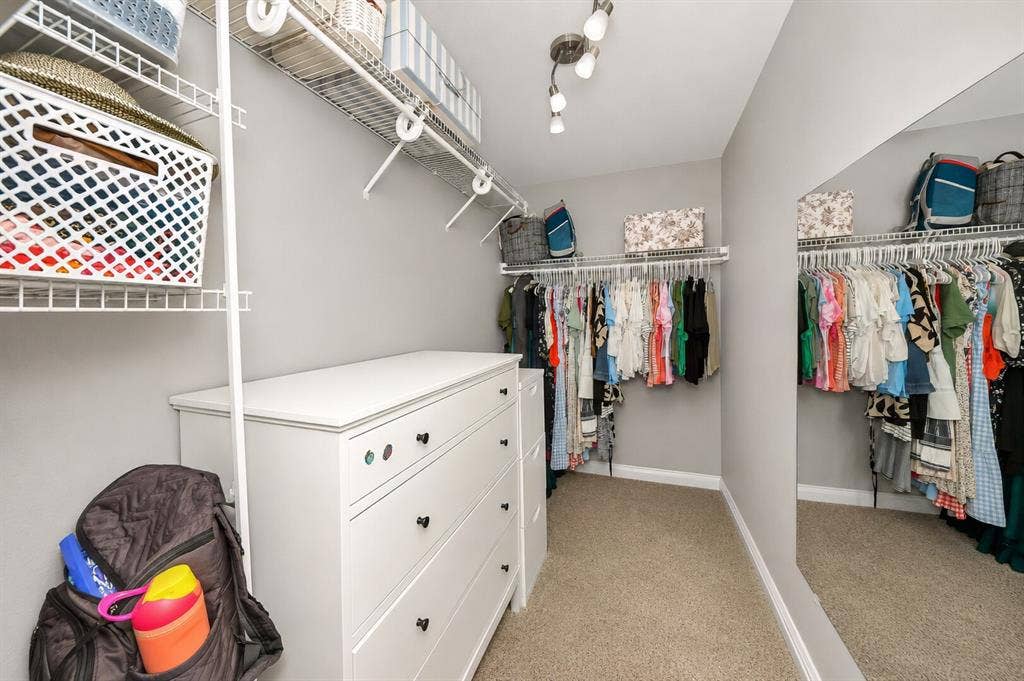 5304 Fox Run Drive, Watauga, TX 76137 This walk-in primary closet off the primary bath offers abundant hanging space, built-in shelving, and room for additional storage, providing an organized and functional extension of the luxurious primary suite. In case you missed it, his closet is in the bedroom.