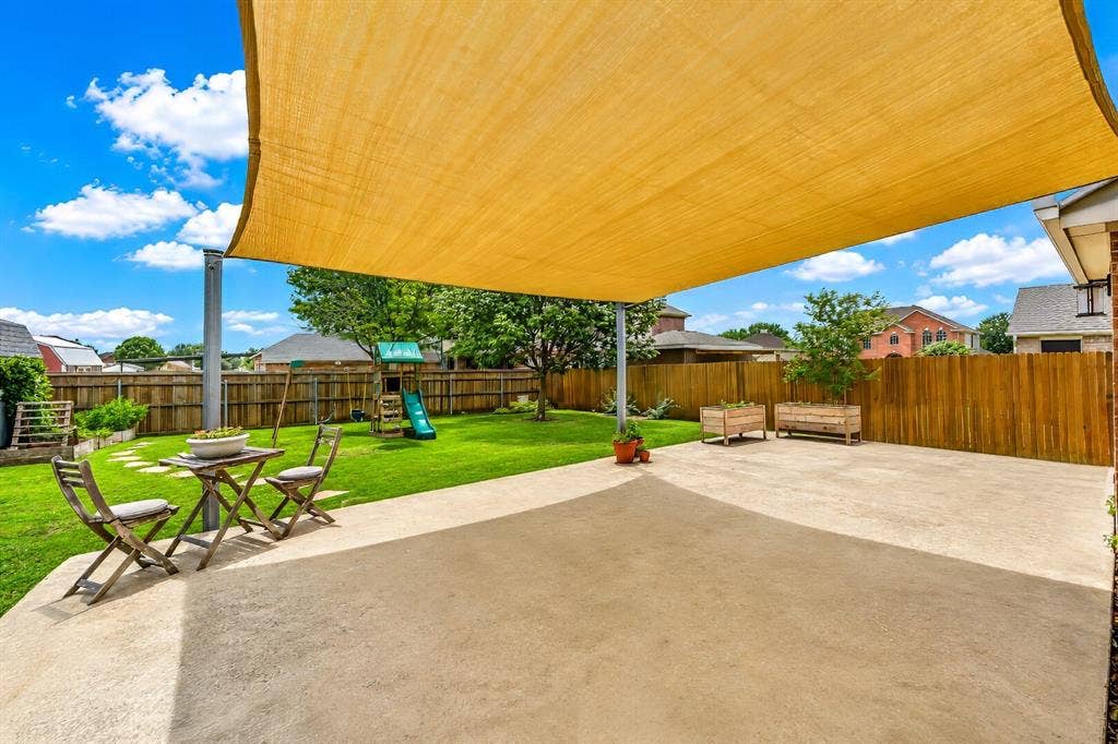 5304 Fox Run Drive, Watauga, TX 76137 Unwind in the shade with a good book, or let the kiddos ride their toys on the oversized patio.