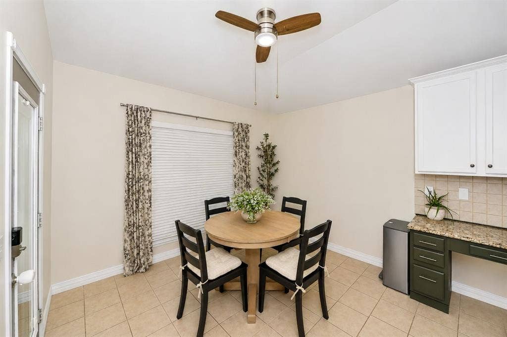 5304 Fox Run Drive, Watauga, TX 76137 The sunny breakfast nook offers a cozy space for casual dining with backyard views, abundant natural light, and direct access to the covered patio.
