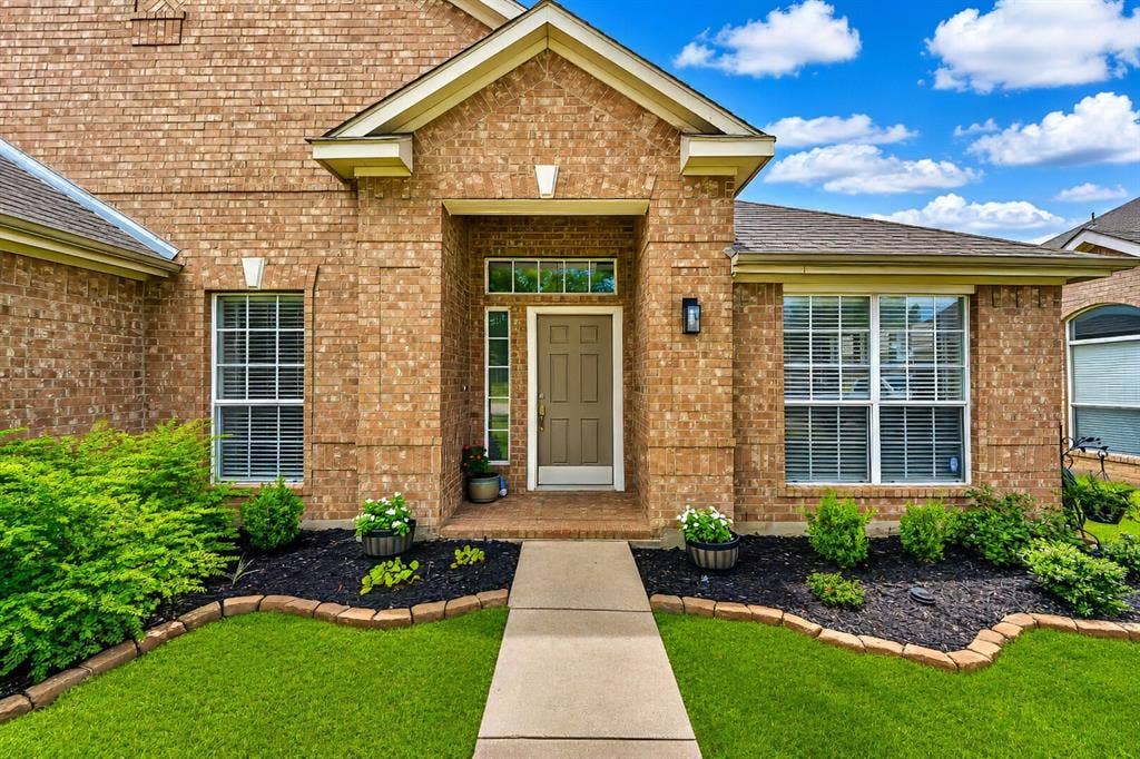 5304 Fox Run Drive, Watauga, TX 76137 Manicured landscaping, and a covered entryway, create exceptional curb appeal from the moment you arrive.