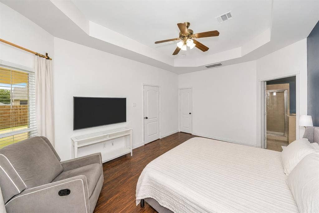 5304 Fox Run Drive, Watauga, TX 76137 A third view of the spacious primary suite highlights its generous dimensions, abundant wall space for furniture or artwork, and flexible layout, offering endless possibilities to personalize your private retreat.