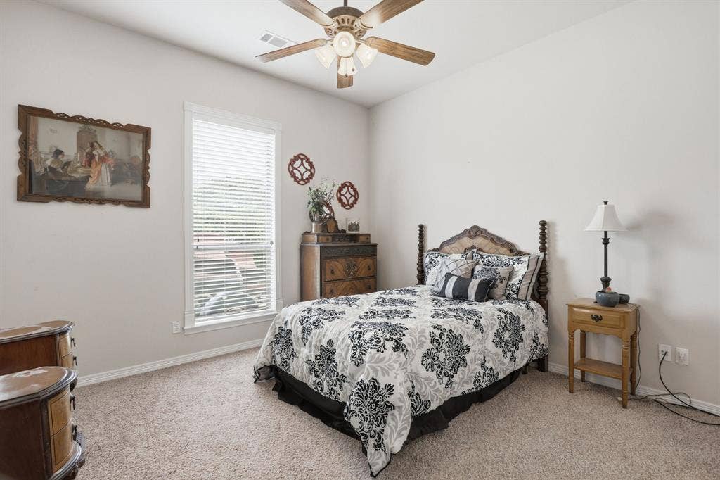 5030 Monroe Court, Midlothian, TX 76065 Carpeted room featuring a single window with blinds, a ceiling fan, and light-toned walls