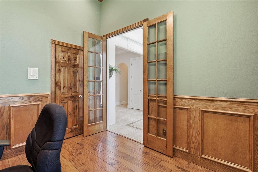 5030 Monroe Court, Midlothian, TX 76065 Interior space featuring a wood-finish floor and paneled wainscoting