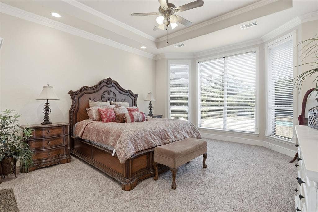 5030 Monroe Court, Midlothian, TX 76065 Carpeted bedroom with a bay window featuring multiple large windows