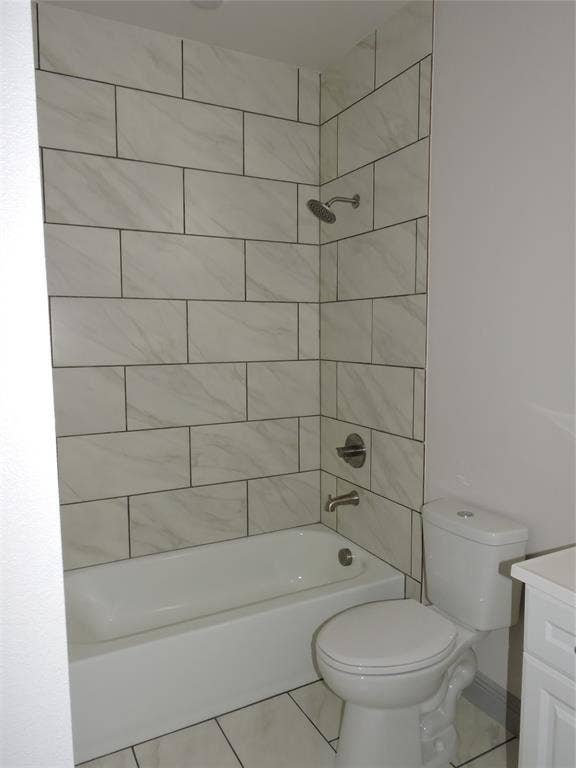 6110 Tejas Drive, Mabank, TX 75156 Bathroom featuring a white bathtub, toilet, and white tile flooring