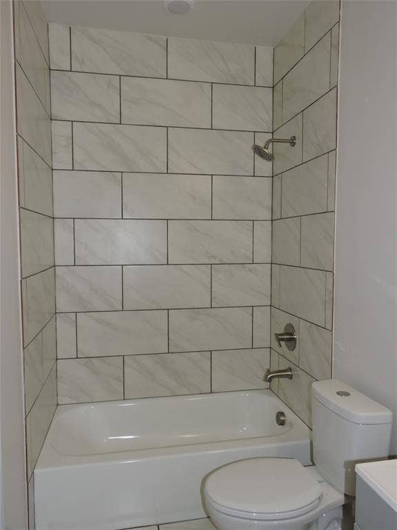6110 Tejas Drive, Mabank, TX 75156 Bathtub and shower combination featuring subway-style tile surround with subtle veining and dark grout