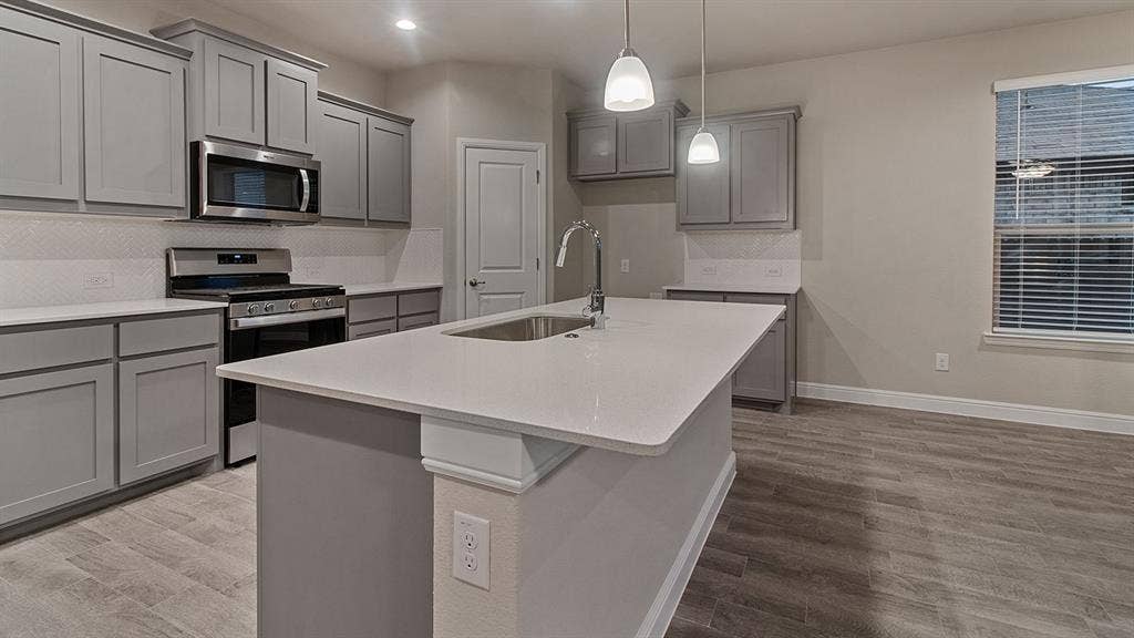 1449 CANTERBURY Trail, DeSoto, TX 75115 Kitchen - All Home and community information, including pricing, included features, terms, availability and amenities, are subject to change at any time without notice or obligation. All Drawings, pictures, photographs, video, square footages, floor plans, elevations, features, colors and sizes are approximate for illustration purposes only and will vary from the homes as built.