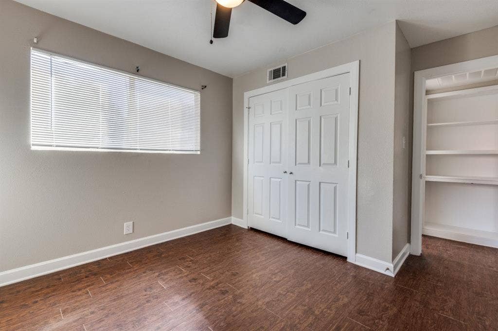 4915 Reiger Avenue, #D, Dallas, TX 75214 Room with wood-finish flooring, a ceiling fan, and neutral wall tones