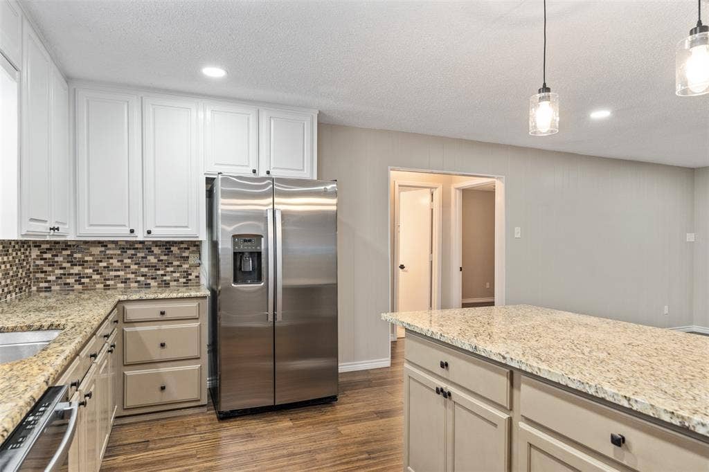 243 Shoreline Drive, Star Harbor, TX 75148 Split floorplan features two bedrooms to the left and primary bedroom to the right of the living/kitchen area.