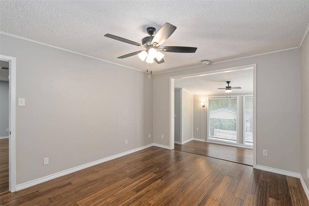243 Shoreline Drive, Star Harbor, TX 75148 Super spacious, light and bright primary bedroom. Walk down a step at the end of the room into the bonus area overlooking the water.
