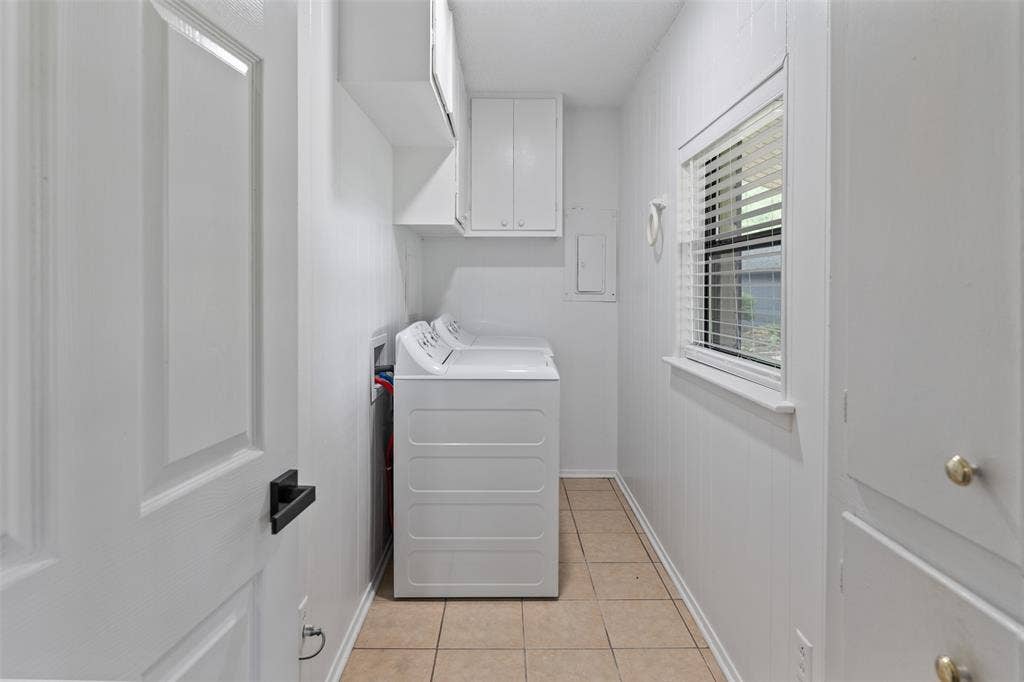 243 Shoreline Drive, Star Harbor, TX 75148 As you enter the home you have a large laundry area that includes a new washer and dryer, cabinets for storage and a linen closet.