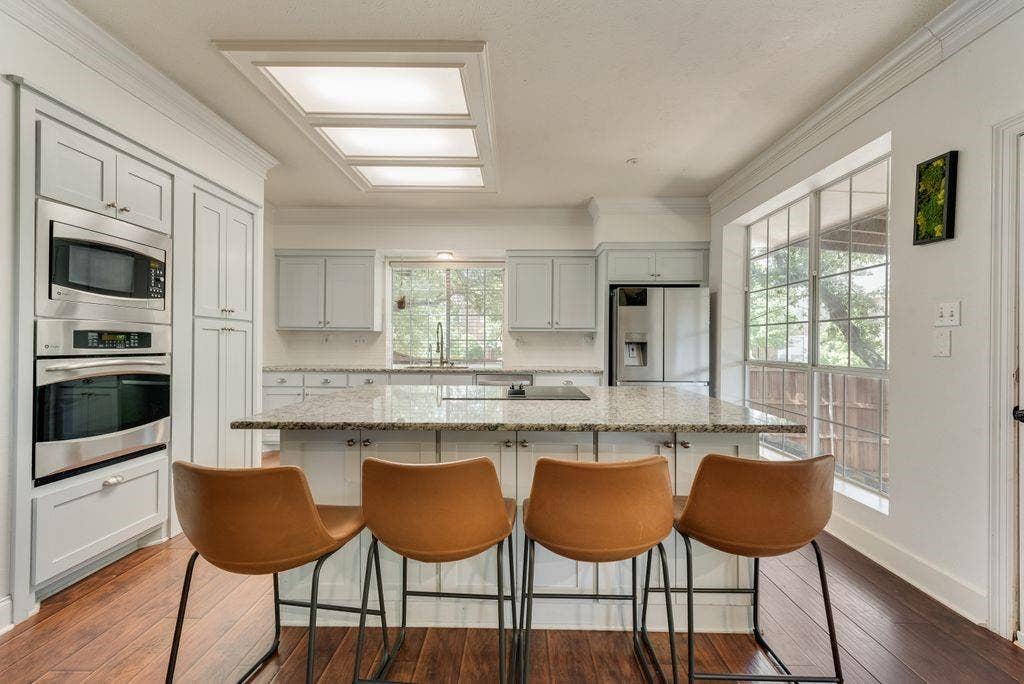 Kitchen was remodeled in 2016, space was opened up, cabinets, granite  & backsplash were replaced and stainless steel appliances were installed.