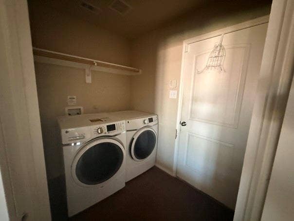 2004 Samantha Lane, Heartland, TX 75126 Dedicated laundry area featuring a wall-mounted shelf, utility hookups, and a paneled door