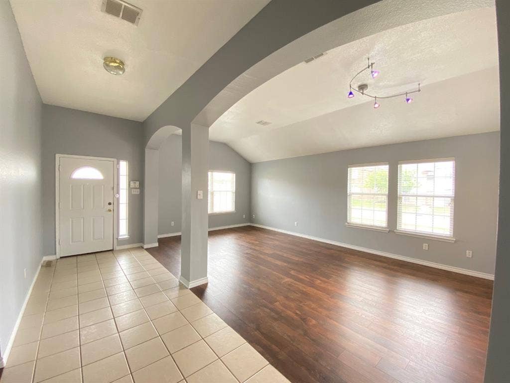1328 Falcon Hollow, Cedar Hill, TX 75104 Entryway featuring light-toned tile flooring and a white front door with a decorative glass insert and sidelight