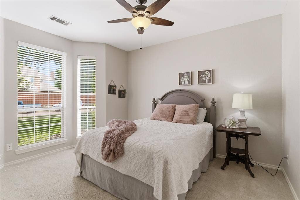 4112 Blackpool Drive, Plano, TX 75093 Carpeted room featuring a ceiling fan with integrated lighting, multiple windows with blinds, and light-toned walls