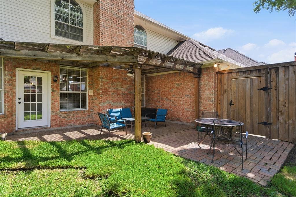 4112 Blackpool Drive, Plano, TX 75093 Brick exterior featuring an attached pergola over a paved patio